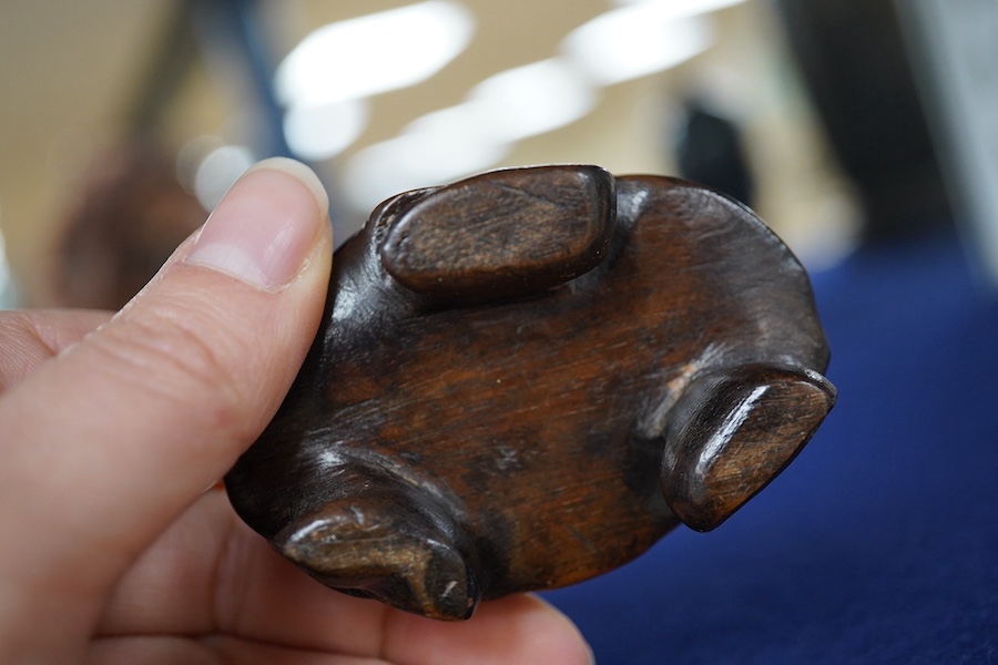 A Chinese buffalo horn vessel, on carved wood stand, 13cm high including stand. Condition - good